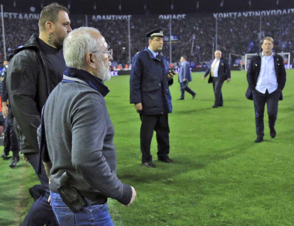 The president of PAOK invades the pitch with a gun.